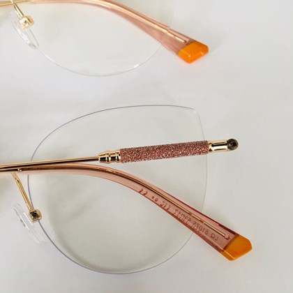Armação de óculos de grau - Malévola 3 pontos cod 81075 - dourado ponteira transparente detalhe laranja C5